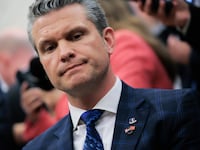 A close-up of Pete Hegseth at a meeting in the Oval Office.