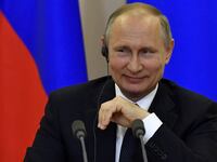 Vladimir Putin smiles during a joint press conference with Italian Prime Minister Paolo Gentiloni following their meeting at the Bocharov Ruchei state residence in Sochi, Russia, May 17, 2017.