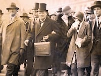 Winston Churchill, Chancellor of the Exchequer, carries the dispatch box on his way to the House of Commons, in London, to present the budget on April 29, 1929.