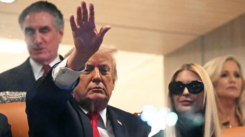 US President Donald Trump and his daughter Ivanka Trump attend the College Football National Championship Game between the Miami Hurricanes and the Indiana Hoosiers at Hard Rock Stadium in Miami Gardens, Florida, on January 19, 2026. (Photo by ANDREW CABALLERO-REYNOLDS / AFP via Getty Images)