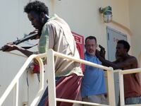 articles/2013/10/15/tom-hanks-on-his-riveting-oscar-moment-that-ends-captain-phillips/131014-captain-phillips-ending-tease_alopc6