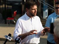 Republican vice presidential nominee U.S. Sen. J.D. Vance (R-OH) speaks with media gathered outside the Park Diner in St Cloud, Minnesota.