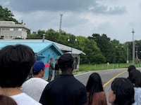 U.S. Private Travis T. King (wearing a black shirt and black cap) is seen in this picture taken during a tour of the tightly controlled Joint Security Area (JSA) on the border between the two Koreas.