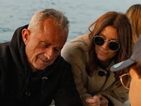 Robert F. Kennedy sits on the deck of a yacht alongside influencer Jessica Reed Kraus.