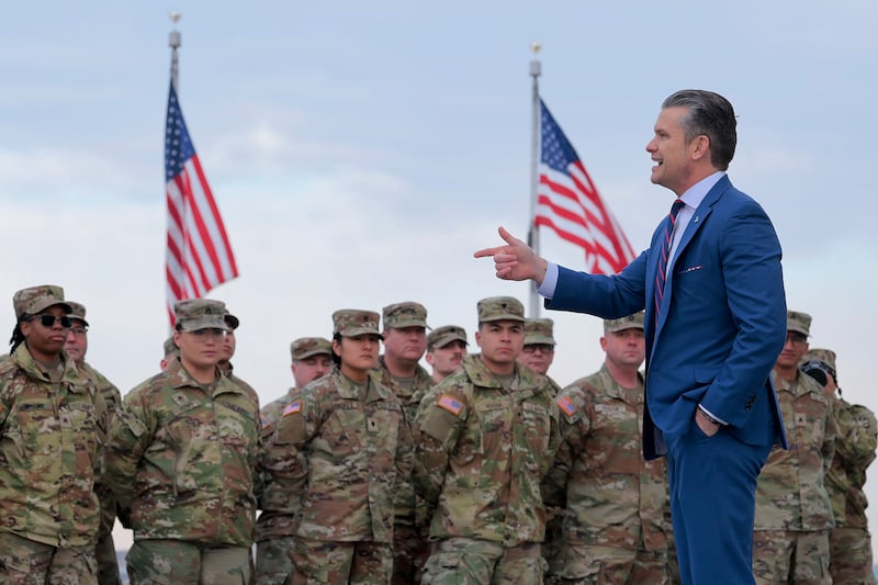 U.S. Secretary of War Pete Hegseth address a group of National Guard troops before administering their re-enlistment ceremony at the base of the Washington Monument on February 06, 2026 in Washington, DC.