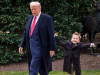 Donald Trump and Æ A-Xii, the son of White House Senior Advisor, Tesla and SpaceX CEO Elon Musk, walks towards Marine One on the South Lawn of the White House.