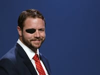 Dan Crenshaw speaks at the Republican Jewish Coalition in 2019.
