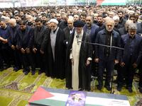 Iran's Supreme Leader Ayatollah Ali Khamenei among a crowd of nearly 10,000 people, performs prayer at the funeral of assassinated Hamas chief, Ismail Haniyeh.