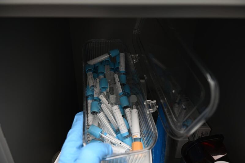 A plastic container of medical vials that were seized from the backyard spa.