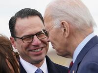 U.S. President Joe Biden is greeted by Governor Josh Shapiro upon arrival in Philadelphia, Pennsylvania, U.S., December 11, 2023.