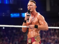 Ludwig Kaiser talks on the microphone during WWE Friday Night SmackDown.