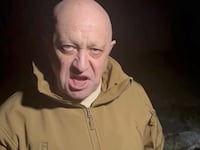 Yevgeny Prigozhin speaks next to the bodies of what he says are Wagner fighters killed in Russia-Ukraine conflict, in an undisclosed location, in this still image taken from video released May 5, 2023.