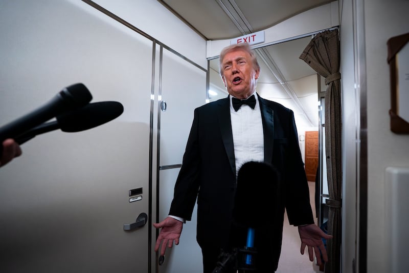 IN FLIGHT - JANUARY 31: U.S. President Donald Trump speaks to reporters and members of the media on board Air Force One on January 31, 2026 while flying in between Washington and West Palm Beach, Florida. President Trump is traveling to his Mar-a-Lago club in Palm Beach, Florida for the weekend. (Photo by Al Drago/Getty Images)