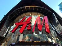 The H&M logo on a storefront