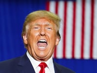 Former U.S. President Donald Trump reacts as he attends a rally in Warren, Michigan, U.S., October 1, 2022.