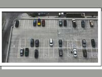 Cars in a parking lot.