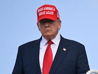 US President Donald Trump steps off Air Force One upon arrival at Joint Base Andrews in Maryland on October 30, 2025. The United States is cutting back the number of refugees to be accepted annually to a record low 7,500 and giving priority to white South Africans. The move, published in the official Federal Register on Thursday, comes after President Donald Trump essentially halted refugee arrivals after taking office in January. (Photo by ANDREW CABALLERO-REYNOLDS / AFP)