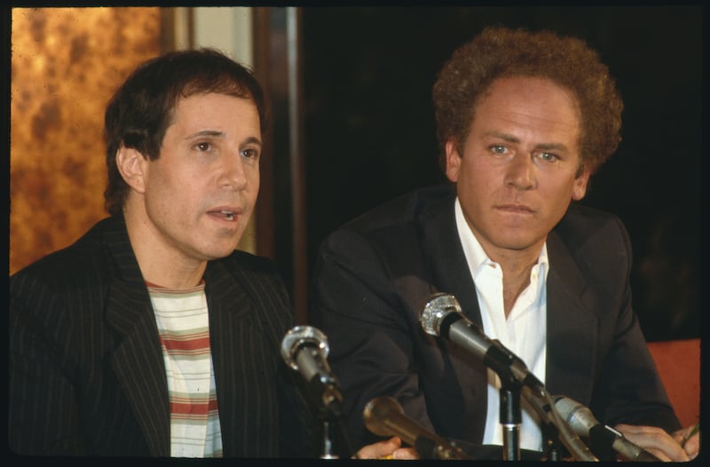 Art Garfunkel and Paul Simon are pictured attending a press conference to promote their 1981 reunion concert in Central Park.