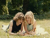 Lea Drucker and Samuel Kircher lay in a field in a still from ‘Last Summer’