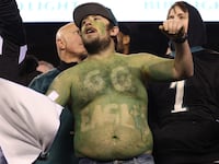 A Philadelphia Eagles fan celebrates in the NFC Championship Game between the San Francisco 49ers and the Philadelphia Eagles at Lincoln Financial Field.