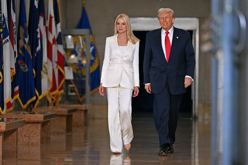 President Donald Trump and Attorney General Pam Bondi arrive to speak at the Department of Justice in Washington, DC, on March 14.