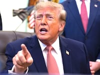 U.S. President Donald Trump gestures to reporters during an event in the Oval Office of the White House on October 20, 2026 in Washington, DC. Trump and Vance announced a new $25 million dollar federal Fraud Whistle Blower Incentive Program with the Department of Justice to pay up to $30,000 to citizens who give verified tips that lead to a conviction or major enforcement action.