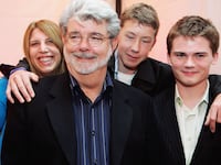 SAN FRANCISCO, CA- MAY 12: (L-R) George Lucas director of Star Wars, Amanda Lucas, Jett Lucas and Jake Lloyd attend the after party of the San Francisco World Premiere of Star Wars: Episode III Revenge of the Sith at the Loews Theaters Metreon on May 12, 2005 in San Francisco, California. The Premiere was a benefit for the Koret Family House, which provides temporary housing for families of children with cancer and other serious illnesses while being treated at UCSF Children's Hospitial. (Photo by David Paul Morris/Getty Images)