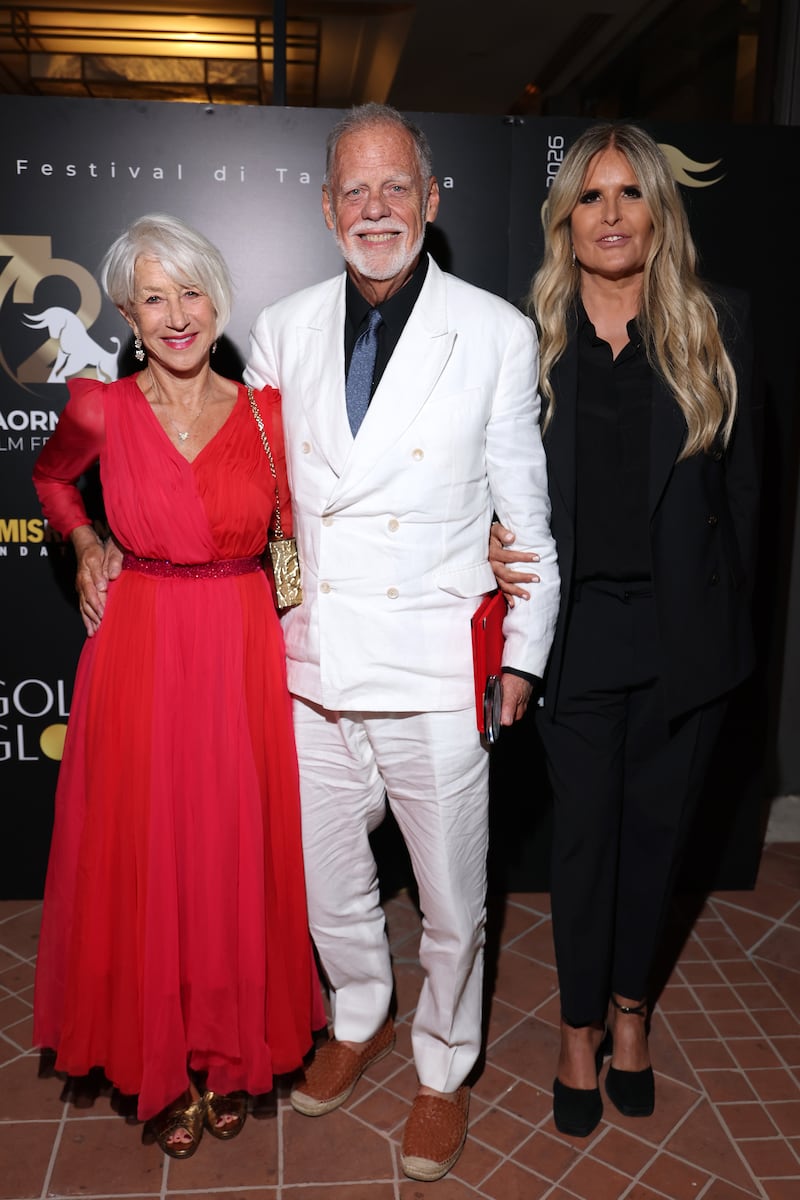 Helen Mirren, Taylor Hackford and Tiziana Rocca attend the Golden Globe dinner honoring Brunello Cucinelli during the 72nd Taormina Film Festival in 2026.