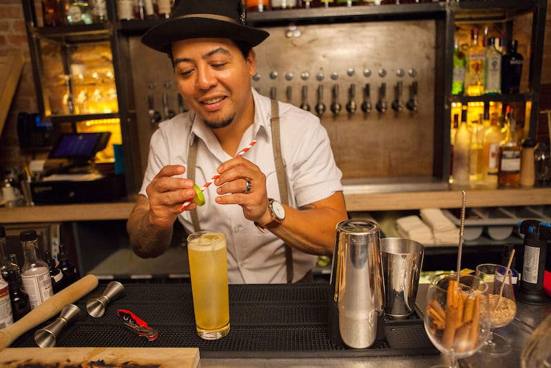 articles/2016/10/21/mamie-taylor-is-the-original-moscow-mule/161020-bartender-adds-lime-embed-3_byxslb
