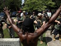 2020-08-15T185602Z_1670374792_RC2IEI9SM4A3_RTRMADP_3_GLOBAL-RACE-PROTESTS-STONE-MOUNTAIN_smzusr