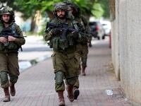 Israeli soldiers patrol following a mass-infiltration by Hamas gunmen from the Gaza Strip, in Sderot, in southern Israel, October 11, 2023.