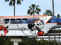 ANAHEIM, CALIFORNIA - APRIL 24: The Disneyland monorail passes near palm trees on April 24, 2023 in Anaheim, California. Disney will lay off several thousand workers this week amid an overall push by the media giant to cut 7,000 total jobs in an effort to save $5.5 billion in costs. (Photo by Mario Tama/Getty Images)