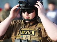 A photo of Adam Kadyrov in tactical shooting equipment.