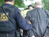 A picture of police arresting Ben Cohen for blocking the entrance to the Department of Justice during a protest of the U.S. government’s prosecution of WikiLeaks publisher Julian Assange.