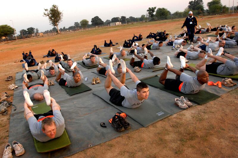 articles/2015/05/23/the-downward-facing-dogs-of-war/150522-adamic-yoga-embed_nhd6qb