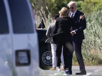 "US President Joe Biden speaks with First Lady Jill Biden after they exiting Marine One in Rehoboth Beach, Delaware Thursday.