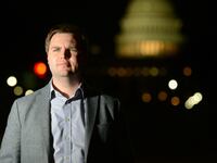 J.D. Vance standing on a D.C. street.