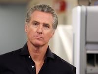 California Governor Gavin Newsom listens before speaking during a press conference announcing $11 insulin and prescription drugs with the CalRX program inside a Cedars-Sinai pharmacy in Los Angeles, California on October 16, 2025.