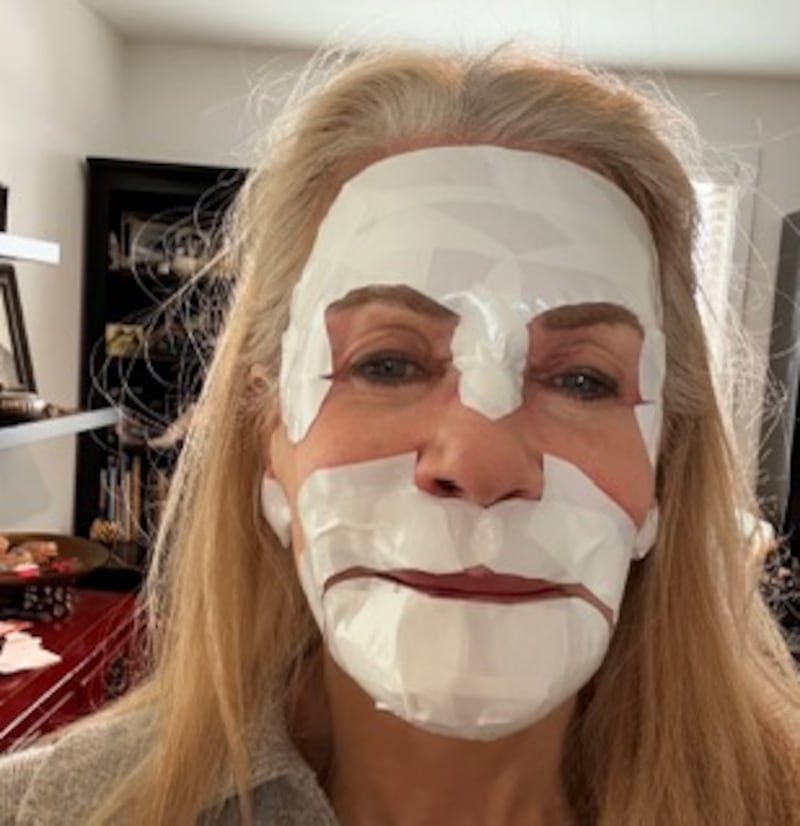 After the procedure, the plastic surgeon placed white tape around Pamela Allyn's face.