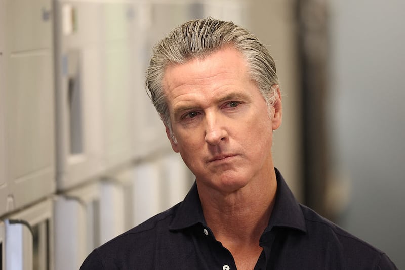 California Governor Gavin Newsom listens before speaking during a press conference announcing $11 insulin and prescription drugs with the CalRX program inside a Cedars-Sinai pharmacy in Los Angeles, California on October 16, 2025.