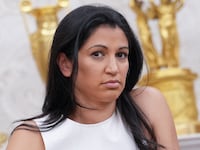 WASHINGTON, DC - MAY 30: White House Deputy Chief of Staff Stephen Miller's wife, Katie Miller, listens as U.S. President Donald Trump and Tesla CEO Elon Musk speak to reporters in the Oval Office of the White House on May 30, 2025 in Washington, DC. Musk, who served as an adviser to Trump and led the Department of Government Efficiency, announced he would leave his role in the Trump administration to refocus on his businesses. (Photo by Kevin Dietsch/Getty Images)