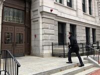 A man walks up to the John Adams Courthouse, which houses the Massachusetts Supreme Judicial Court in Boston, Massachusetts, March 6, 2018.