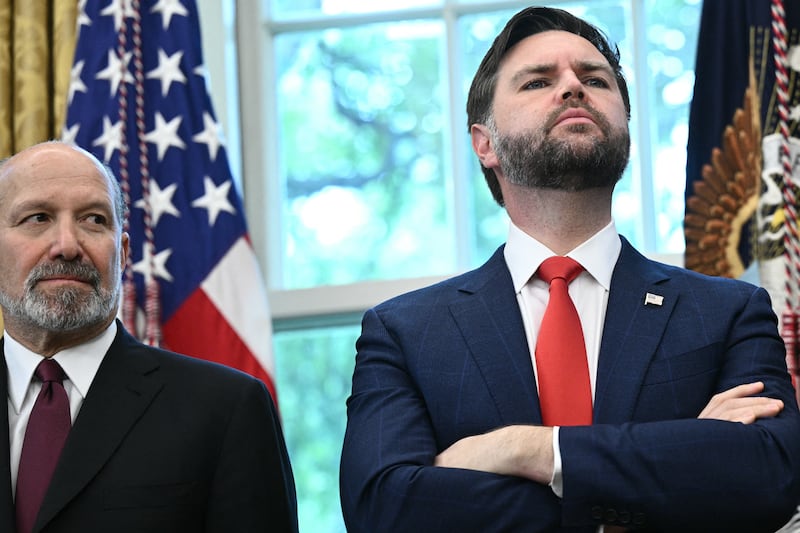 (L/R) US Secretary of Commerce Howard Lutnick, Vice President JD Vance, and Director of Medicare and Deputy Administrator of CMS Chris Klomp look on as US President Donald Trump makes an announcement on prescription drugs in the Oval Office of the White House in Washington, DC, on September 30, 2025. Trump on Tuesday announced a deal with the pharmaceutical giant Pfizer that he said would lower certain drug prices in the United States, without providing specifics. The US president, flanked by top officials, was scant on details but indicated the deal involves granting the company a three-year reprieve on planned pharmaceutical tariffs. The announcement saw Pfizer's stock price rise by five percent. (Photo by Brendan SMIALOWSKI / AFP) (Photo by BRENDAN SMIALOWSKI/AFP via Getty Images)