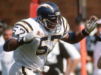 Todd Christensen #46 of the Los Angeles Raiders catches a pass over Keith Browner #57 of the San Diego Chargers during an NFL football game September 4, 1988 at the Los Angeles Memorial Coliseum in Los Angeles, California. Christensen played for the Raiders from 1979-88.