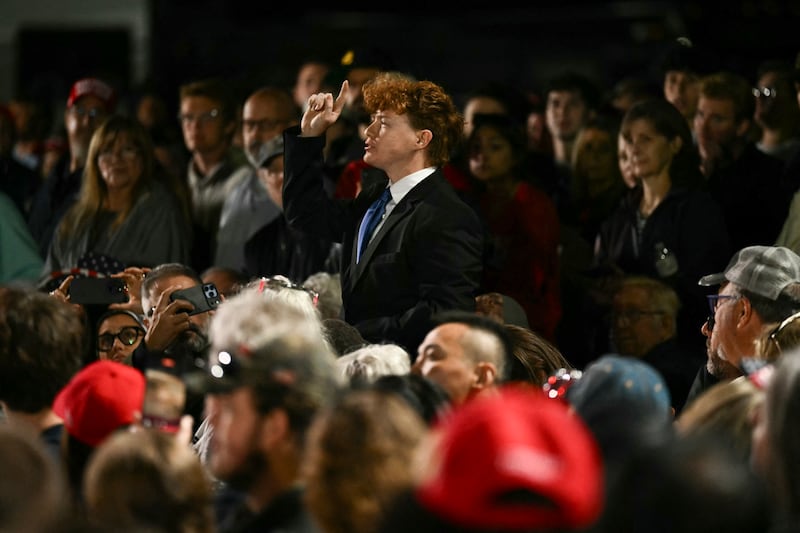 A protestor shouts as US President Donald Trump speaks at a midterm campaign rally at Pitt-Greenville Airport in Greenville, North Carolina, on October 20, 2026. (Photo by Kent NISHIMURA / AFP via Getty Images)