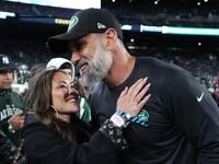 EAST RUTHERFORD, NEW JERSEY - OCTOBER 14: Interim head coach Jeff Ulbrich of the New York Jets and his wife, Cristina Ulbrich, embrace prior to the game against the Buffalo Bills at MetLife Stadium on October 14, 2024 in East Rutherford, New Jersey. (Photo by Elsa/Getty Images)