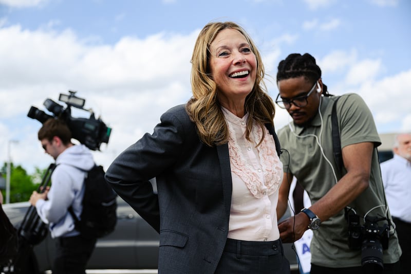 Dr. Amy Acton, Ohio Democratic gubernatorial candidate and former director of the Ohio Department of Health, is fitted with a microphone during a rally on April 28, 2026 in Cincinnati, Ohio.