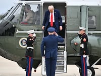 US President Donald Trump steps off Marine One before making his way to board Air Force One at Joint Base Andrews in Maryland on September 21, 2025. Trump is heading to Glendale, Arizona to attend the public memorial service for Charlie Kirk.