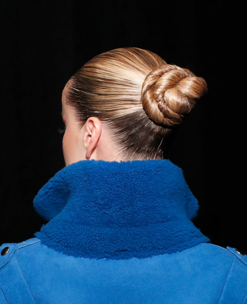 The back of model Frida Aasen's head, showing her updo details.