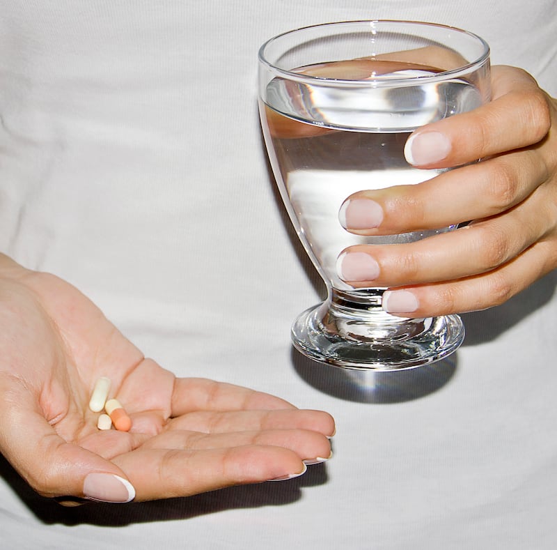 Supplements in a hand